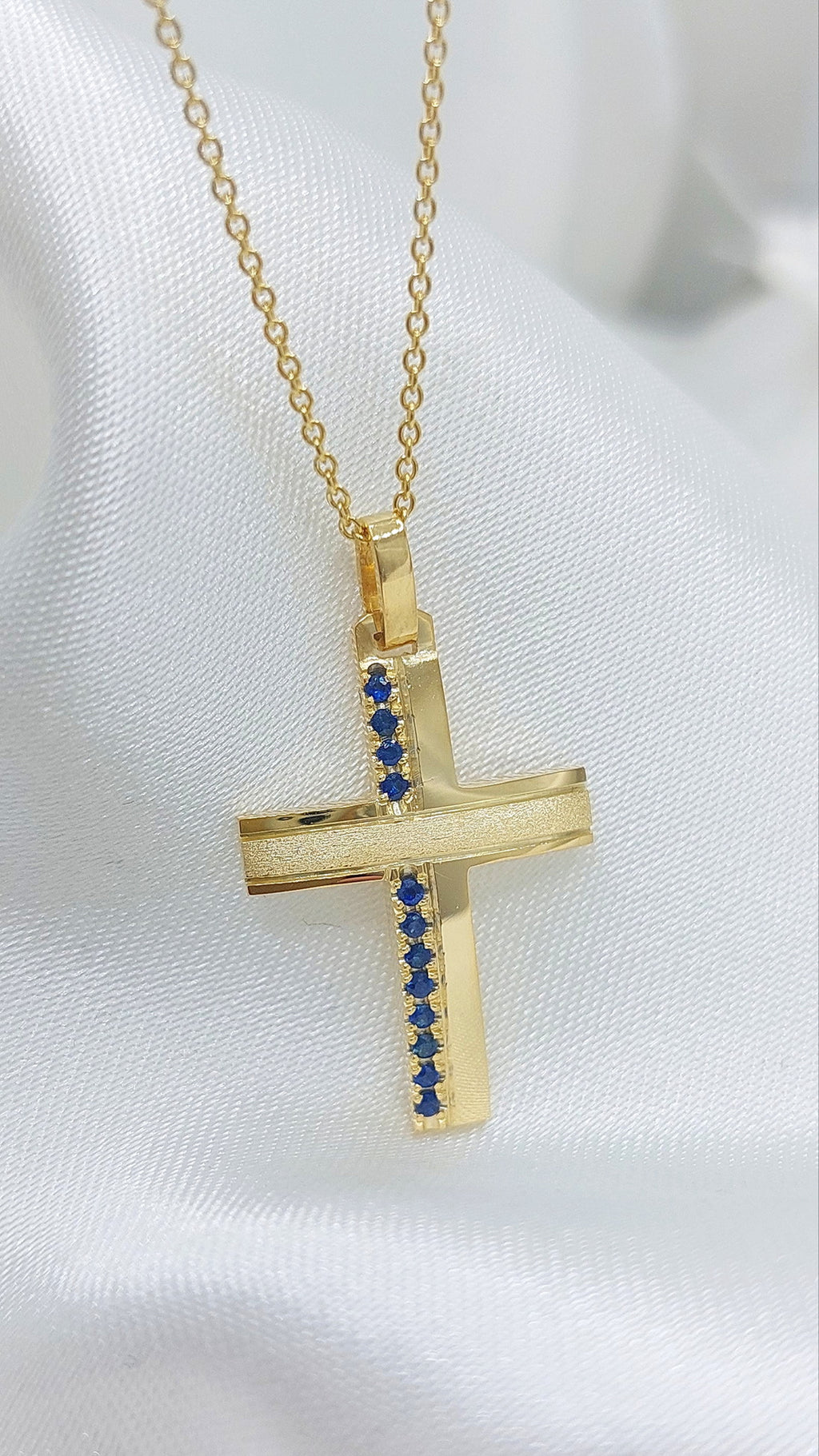 Solid Gold cross with Sapphires