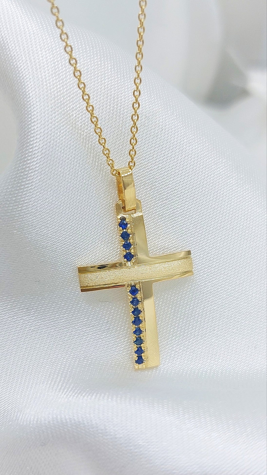Solid Gold cross with Sapphires
